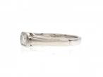 Art Deco style emerald cut diamond east to west diamond solitaire ring