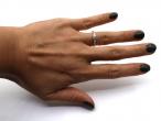 Flanked diamond solitaire engagement ring in 18kt yellow gold