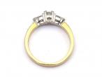 Flanked diamond solitaire engagement ring in 18kt yellow gold