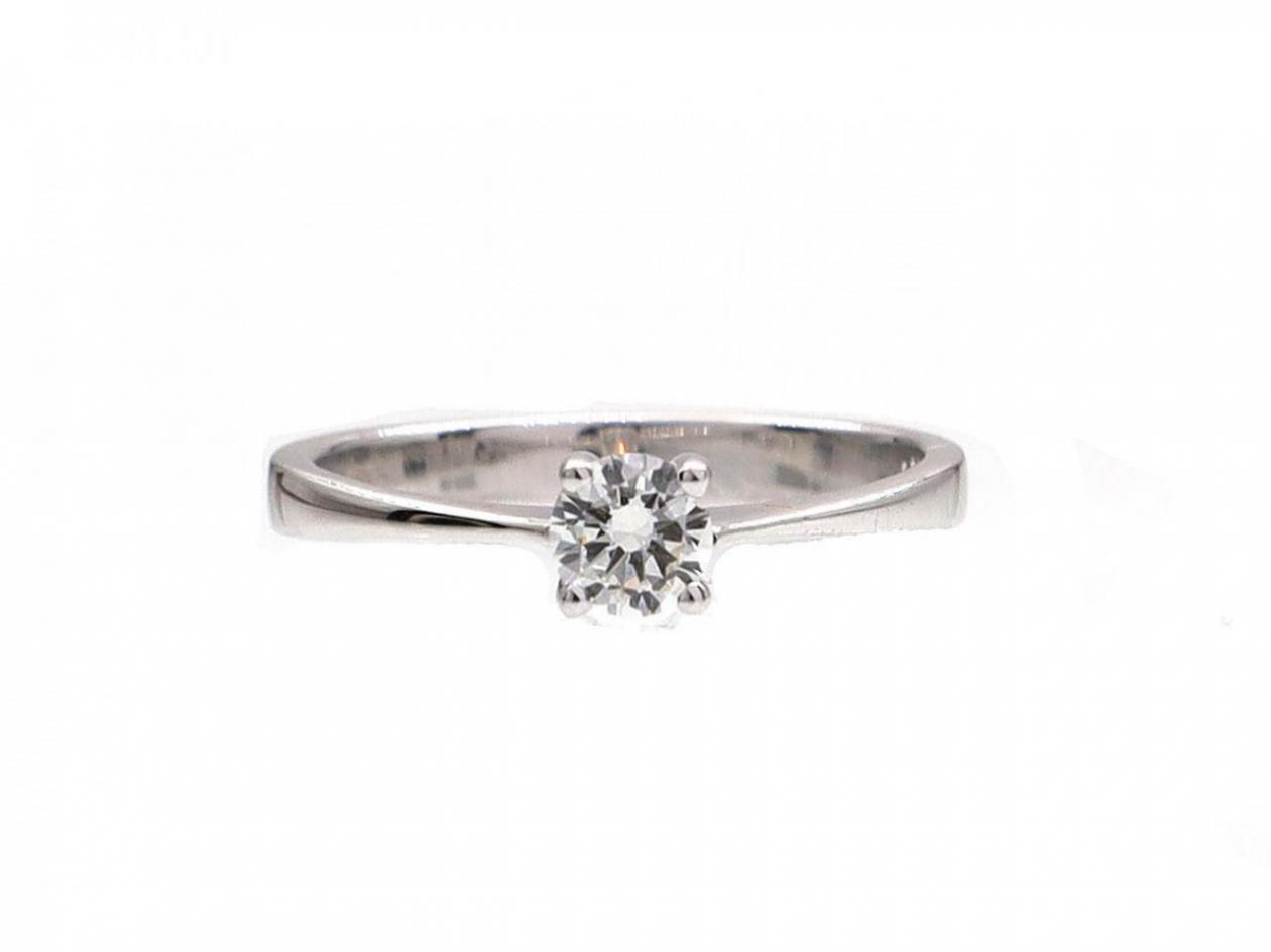 Four claw round brilliant cut diamond solitaire ring