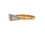 Antique diamond solitaire engagement ring with leaf motifs