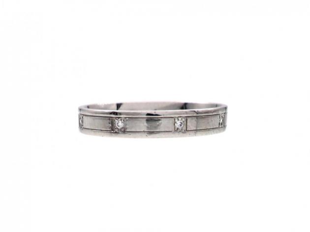 Platinum diamond set ring with incised borders