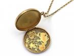 Art Nouveau plique-à-jour flower locket in 18kt yellow gold