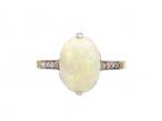 Edwardian oval opal solitaire ring with diamond shoulders