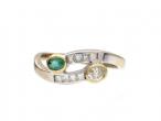 Contemporary emerald and yellow diamond two stone twist ring