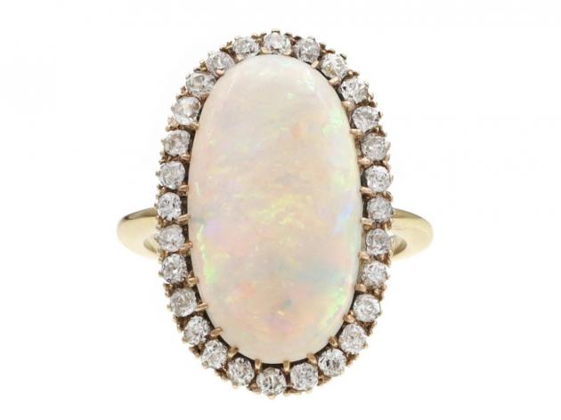 Edwardian oval opal and diamond cluster ring in 18kt yellow gold