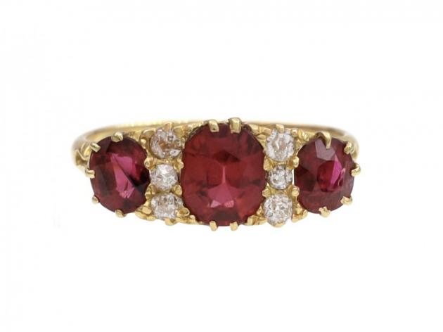 Victorian ruby and diamond three stone carved ring in 18kt yellow gold