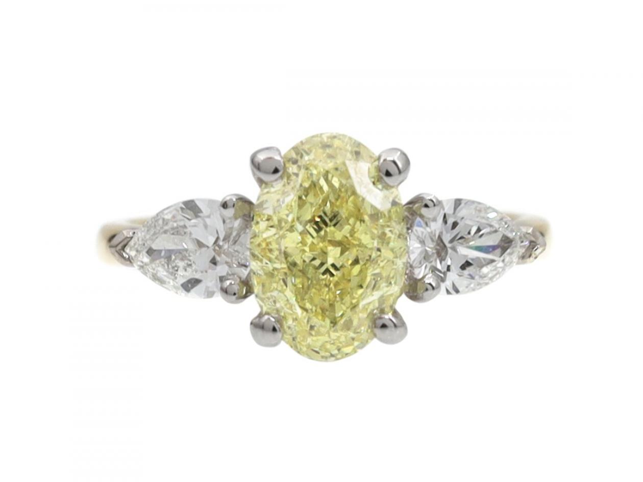 Brilliant Cut Oval Yellow Diamond & Diamond Three Stone Engagement Ring in 18kt Gold