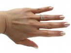 Vintage diamond solitaire engagement ring with floral motifs in gold