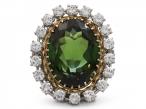 Retro green tourmaline and diamond oval cluster ring in gold and platinum