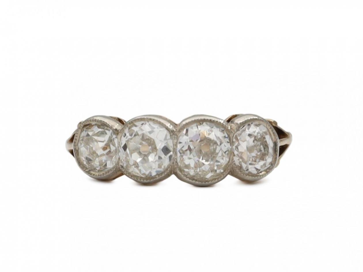 Antique Old Mine cut diamond four stone ring in gold