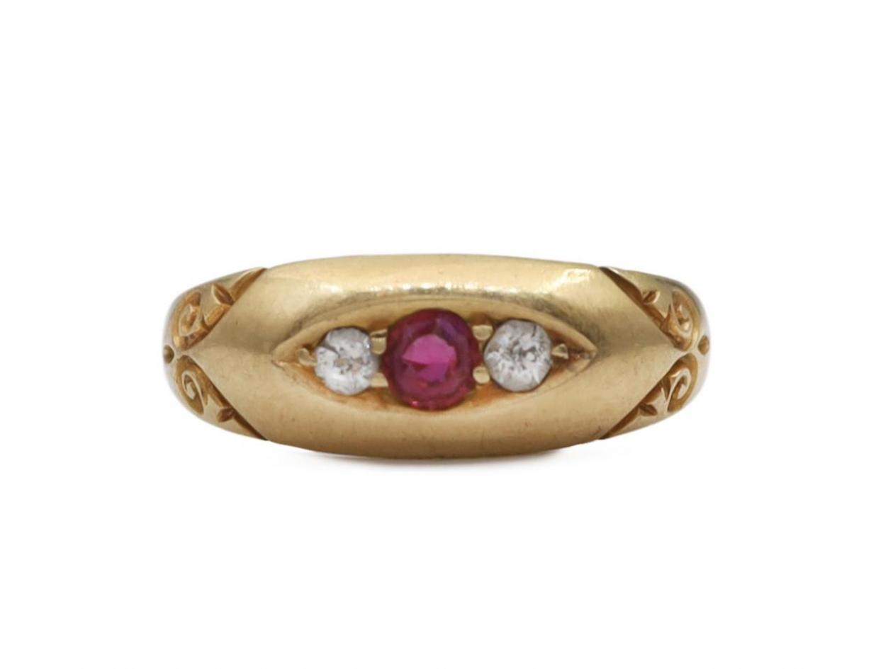 1898 ruby and diamond three stone flush set ring in gold