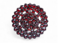 Antique silver gilt brooch set with rose-cut garnets in a domed circular cluster