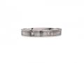 Platinum diamond set ring with incised borders