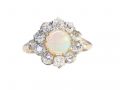 A Victorian cluster ring featuring a cabochon opal