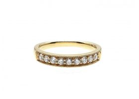 Diamond grain set half eternity ring in 18kt yellow gold