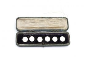 Antique set of round white enamel buttons