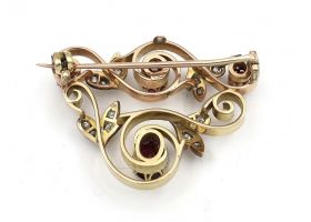 Garland style ruby and diamond brooch in yellow gold