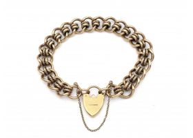1987 solid yellow gold curb bracelet with heart lock