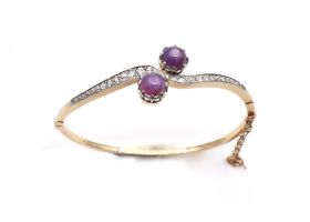 Antique two stone star ruby and diamond twist bangle in gold