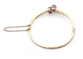 Antique two stone star ruby and diamond twist bangle in gold