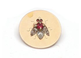 1906 fly disk brooch in 18kt yellow gold