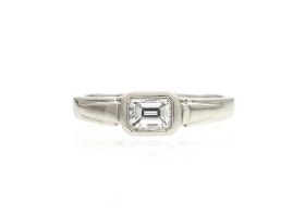 Art Deco style emerald cut diamond east to west diamond solitaire ring