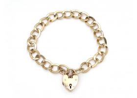 1967 oval curb link heart lock bracelet in yellow gold