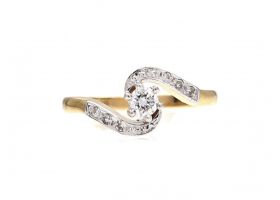 Diamond solitaire twist engagement ring in 18kt yellow gold