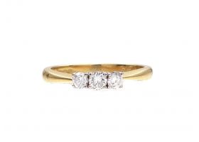 Three stone diamond engagement ring in 18kt yellow gold