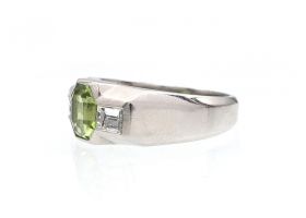 Art Deco peridot and diamond three stone ring in platinum