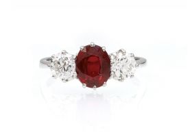 Contemporary oval ruby and diamond three stone ring