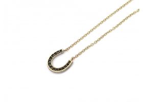 Diamond set horseshoe pendant in silver and yellow gold