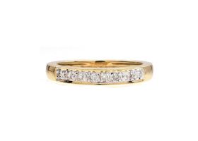 Diamond illusion set half eternity ring in 18kt yellow gold