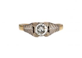 Antique diamond solitaire engagement ring with leaf motifs
