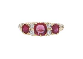 1902 ruby and diamond three stone carved ring in 18kt yellow gold