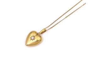 Antique pearl set heart pendant with open locket in gold