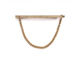 1974 engine turned tie slide with curb chain in 9kt gold