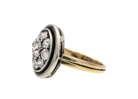 Antique circular diamond cluster ring in platinum and 18kt yellow gold