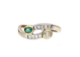Contemporary emerald and yellow diamond two stone twist ring