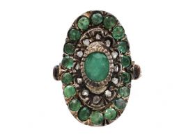 Vintage emerald and diamond oval cluster ring in silver and gold