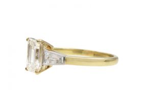 Vintage emerald cut diamond solitaire engagement ring in yellow gold