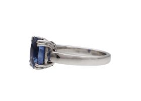 Modern oval sapphire solitaire ring in 18kt white gold