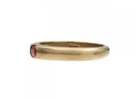 Modern 9kt yellow gold and oval ruby stacking ring
