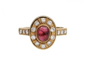 Vintage cabochon ruby and diamond oval cluster ring in gold