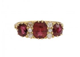 Victorian ruby and diamond three stone carved ring in 18kt yellow gold
