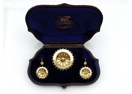 1890s yellow gold and black enamel demi-parure