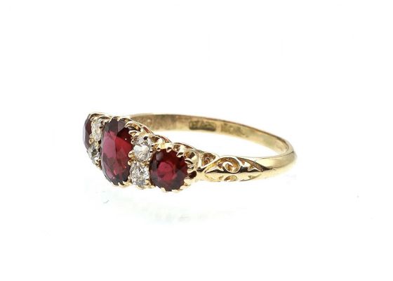 Victorian ruby and diamond three stone carved ring in gold