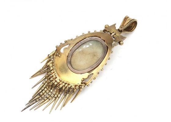 Antique emerald and seed pearl oval tassel locket in gold