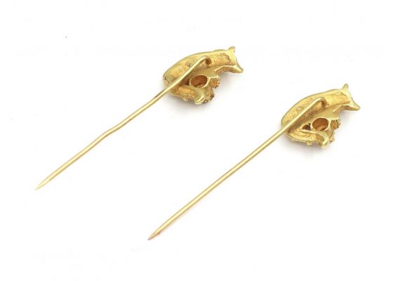 Matching pair of diamond set wolf stick pins in yellow gold